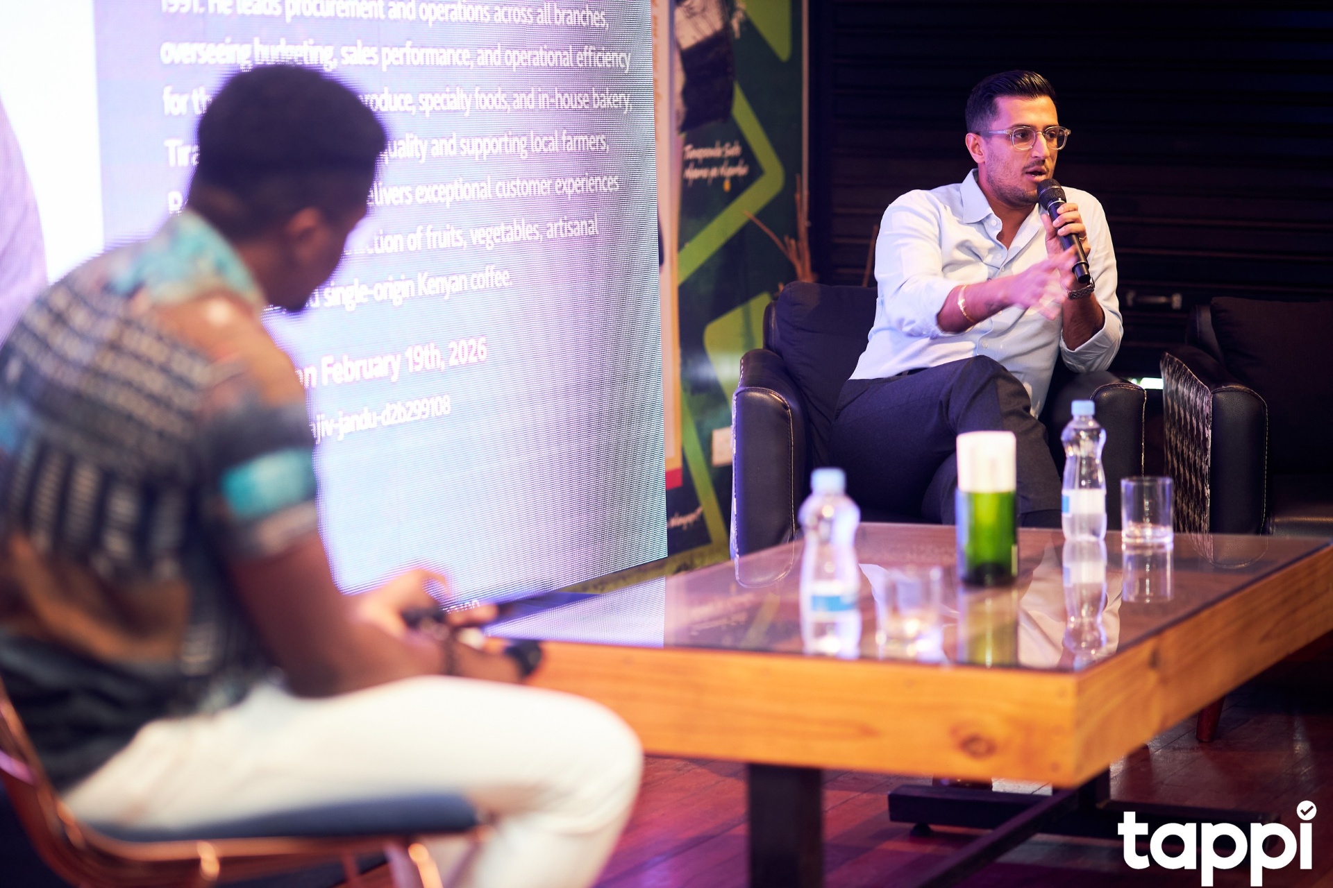 Speaker addressing the room at Respect the Hustle