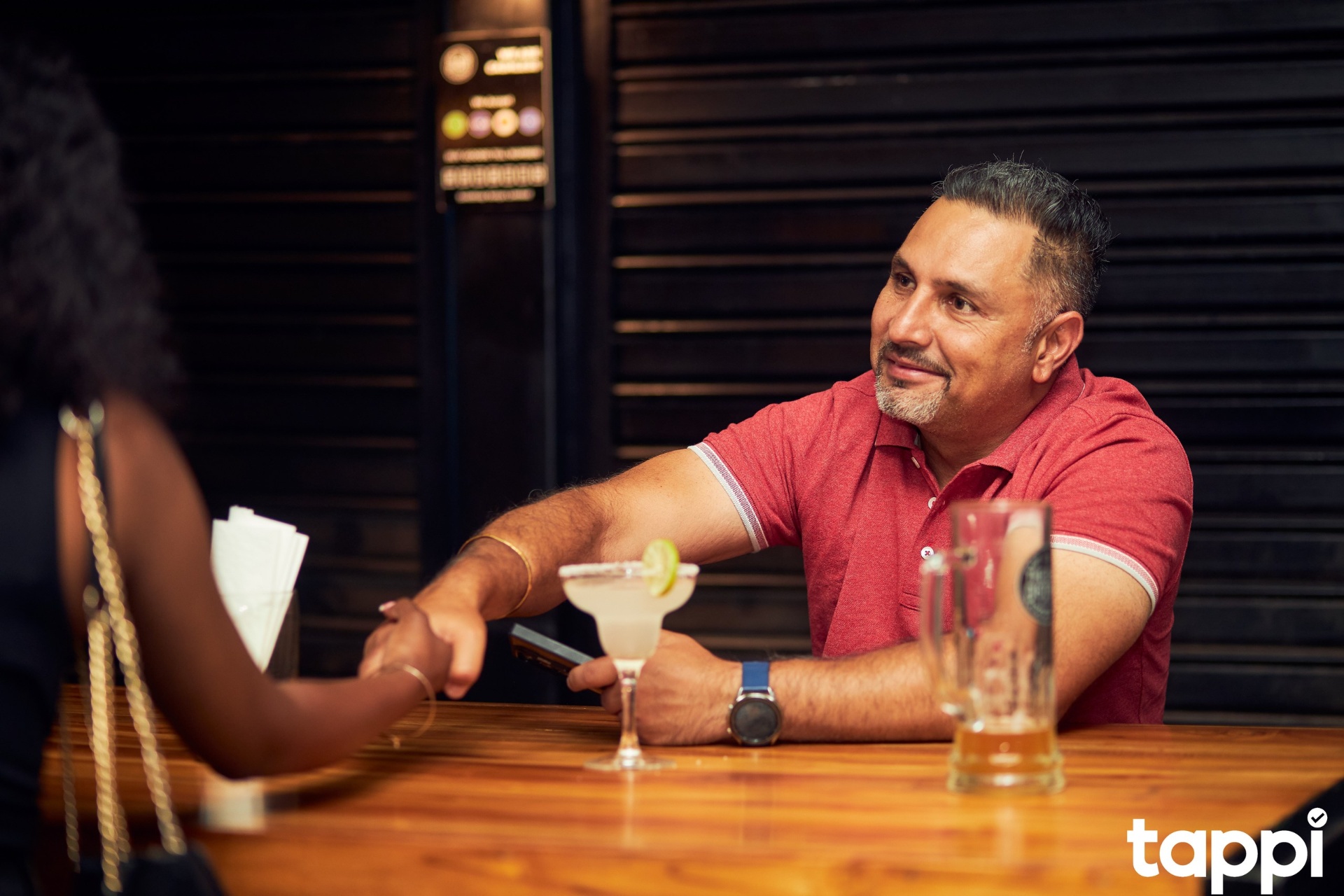 Warm handshake at the bar